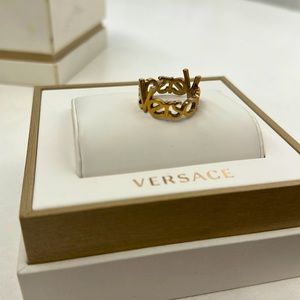 Gold men’s Versace ring